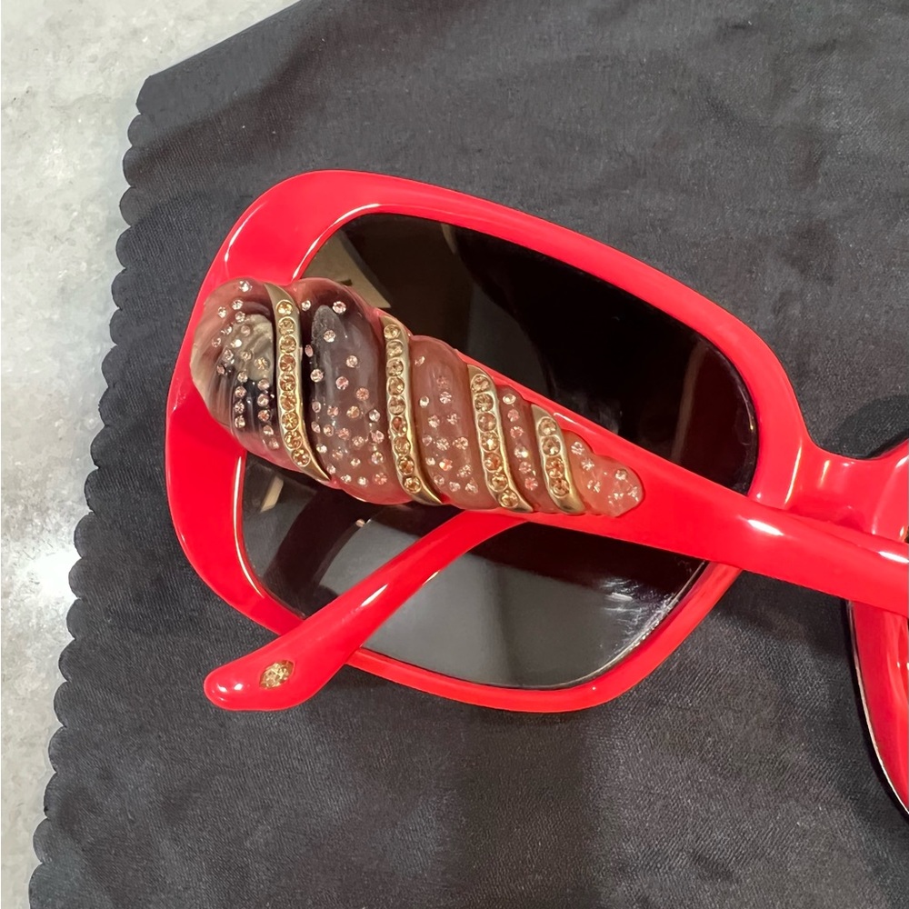 Judith Leiber Sunglasses! Amazing Barbie pink. She’ll crystals on the temples